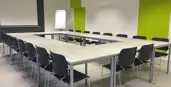 "An empty meeting room with screen"